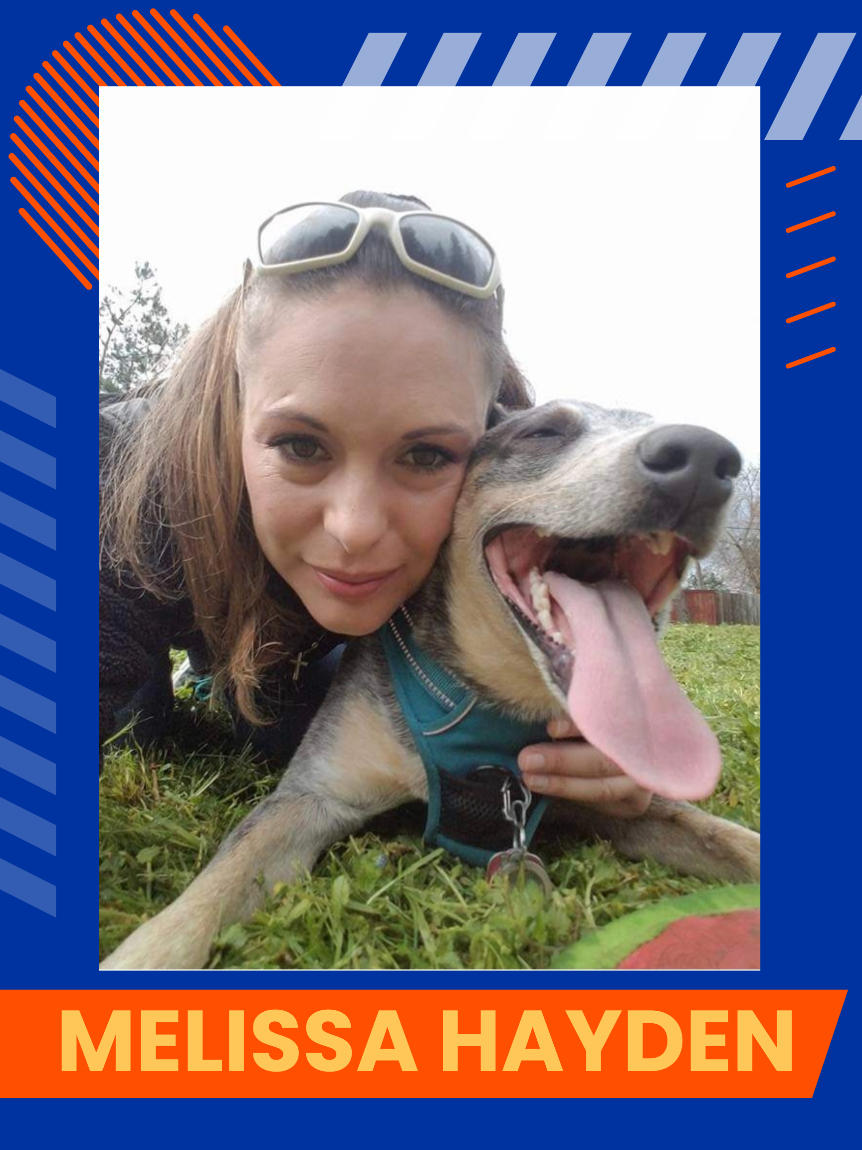 Melissa Hayden, a woman laying down on the grass with a dog. 
